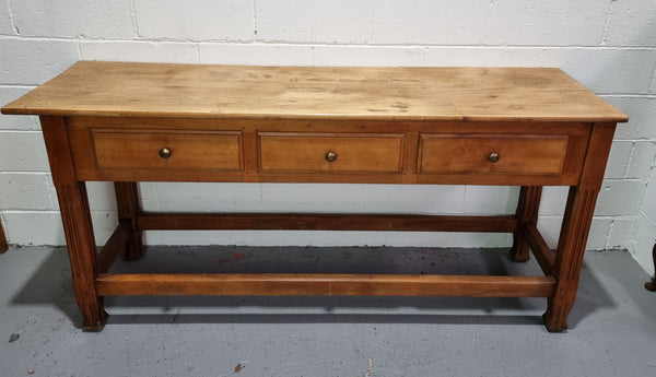 Late 19th Century Cherrywood console table with three drawers. In good used, detailed rustic condition.