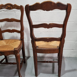 Lovely set of six French oak rush seated provincial dining chairs. They have been sourced from France and are in good detailed condition.