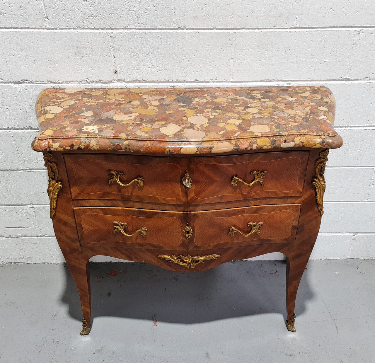 High quality French Mahogany Louis XVth style marble top commode. It has an eye catching marble top and is signed on body "J Bamelis". In very good original detailed condition.