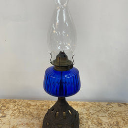Victorian blue glass kero lamp with decorative metal base. Circa 1880's.