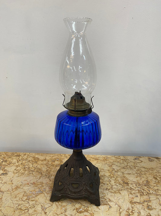 Victorian blue glass kero lamp with decorative metal base. Circa 1880's.