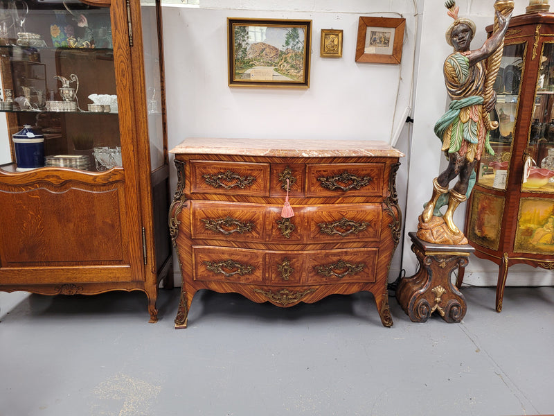 Beautiful French Louis XV style Kingwood inlaid marble top four drawer commode. It has decorative mounts and has been sourced from France. It is in good original detailed condition.