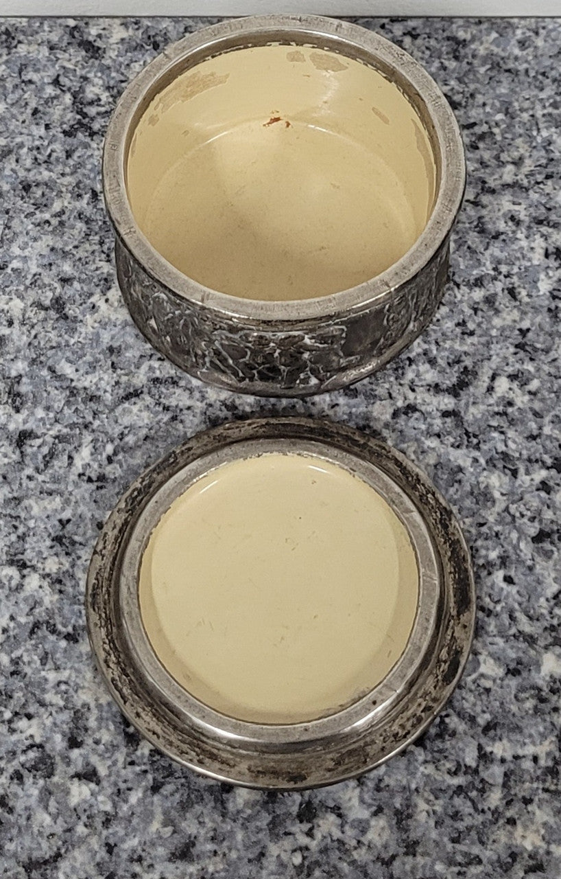 Unusual Antique silver over pottery Italian trinket box nicely decorated with Cherubs. It is in good original condition, please view photos as they help form part of the description.