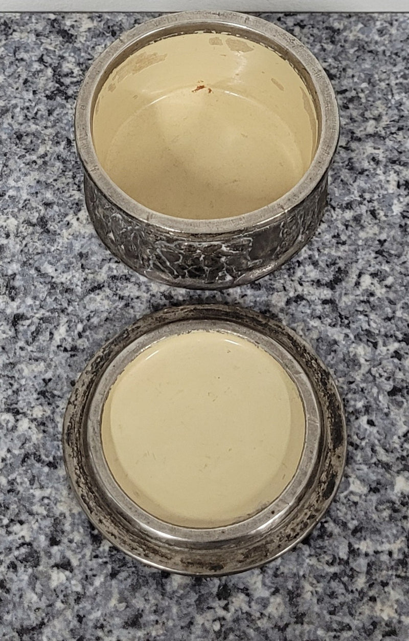 Unusual Antique silver over pottery Italian trinket box nicely decorated with Cherubs. It is in good original condition, please view photos as they help form part of the description.