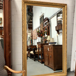 Very large French style mirror with beveled glass. In very good original condition.