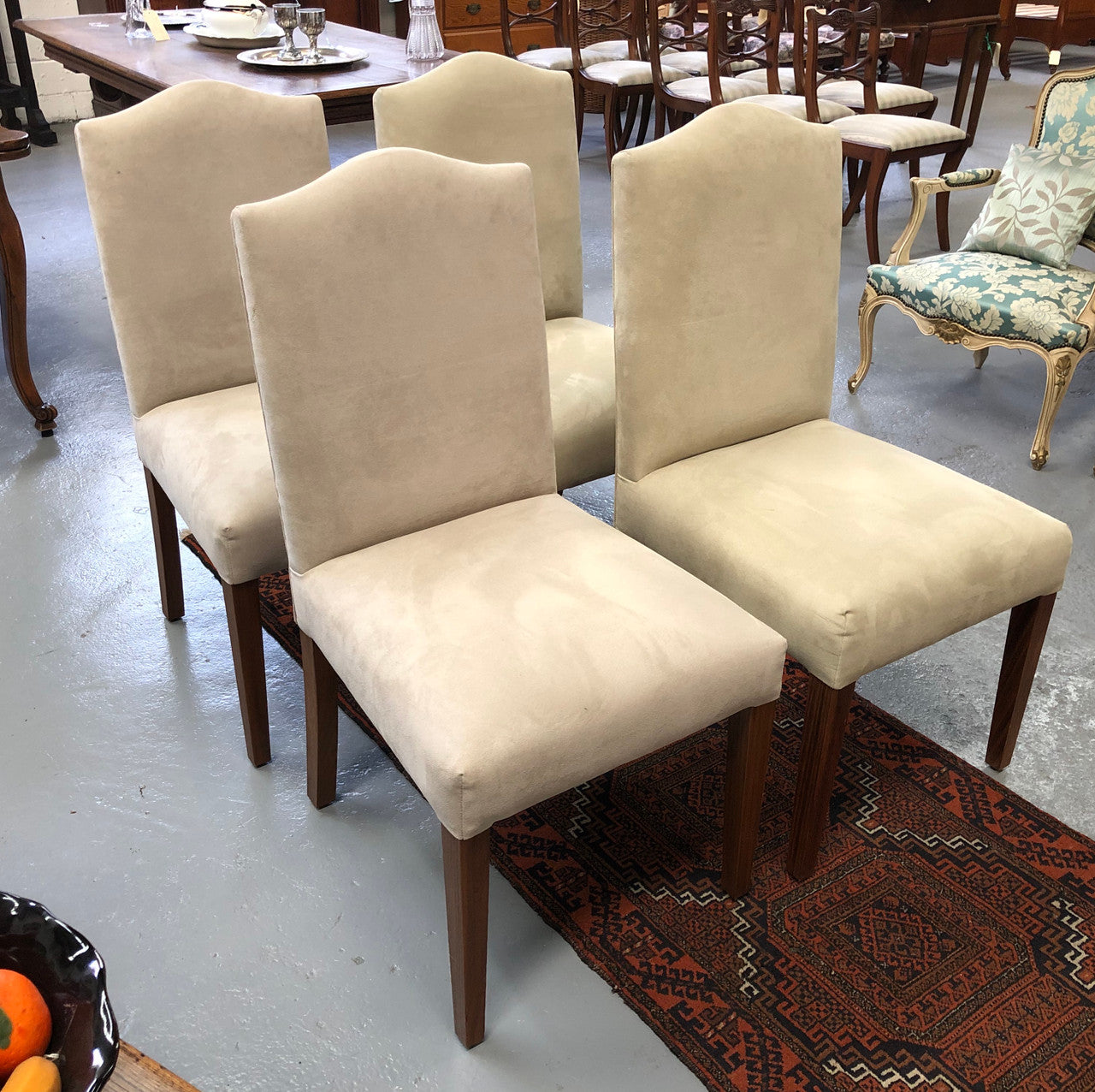 Beautiful set of four upholstered taupe/ light fawn dining chairs which are very comfortable to sit in. They are in good original conditon.