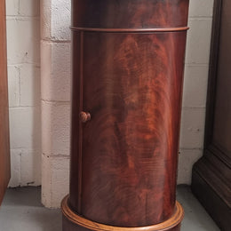 Unusual Empire flame Mahogany cylindrical marble topped bedside/pedestal. Would make an ideal pedestal with added storage inside or could be used as a bedside. Sourced from France and is in good original detailed condition.