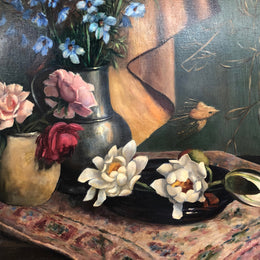 An Antique gilt-framed oil painting of floral still life. Housed in a double sweep gilt frame, signed and dated in good condition.