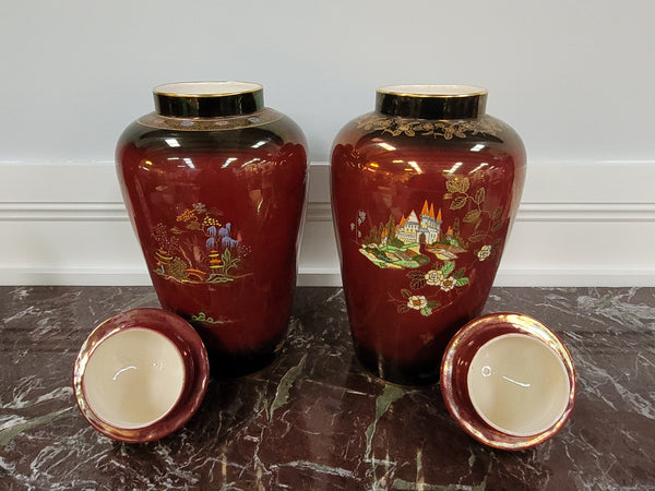 Matched pair of very large Crown Devon hand painted Ruby lustre vases with Lids. They are in good original condition with no chips or cracks.