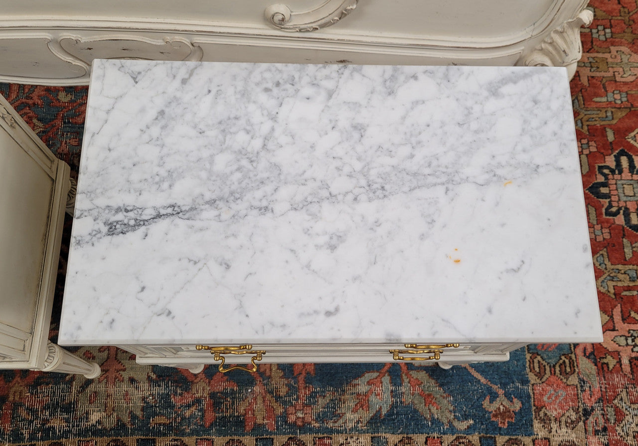 Attractive pair of Vintage French Louis 16th style two drawer marble topped bedsides. They have been sourced from France and are in good original condition.