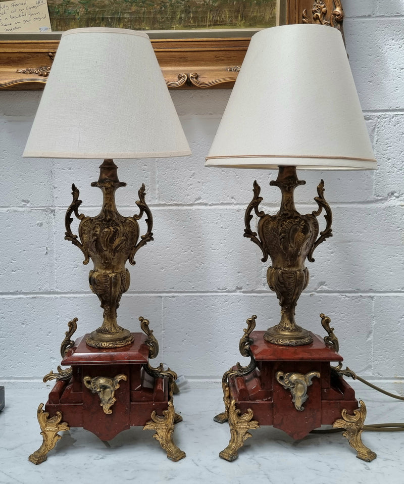 Pair of decorative French Louis XV style marble and gilt metal lamps with shades. In good original detailed working condition.