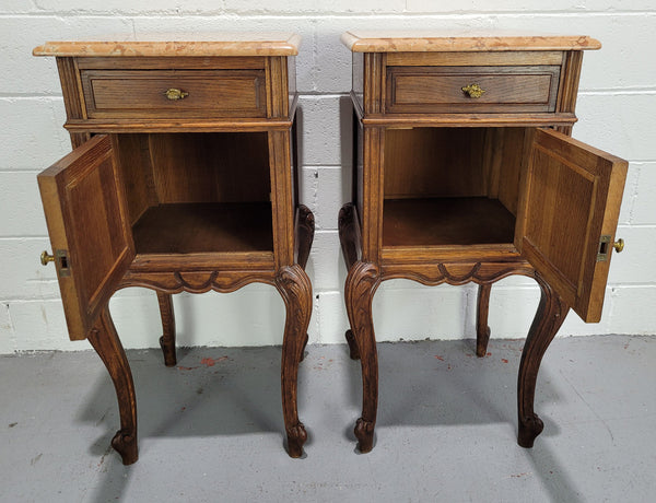 Stunning French walnut Henry II style marble top side cabinet with two drawers and two shelves inside. In good original detailed condition.