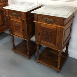 Pair of French Oak Arts and Crafts bedsides cabinets with lovely Carrara marble top and drawer and cupboard for storage. In good original detailed condition.