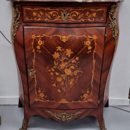 Stunning French Transitional style Mahogany marquetry inlay salon cabinet in the bombe shape. It has one draw, one shelf, marble top & ormolu decoration. Sourced from France and in good original detailed condition.