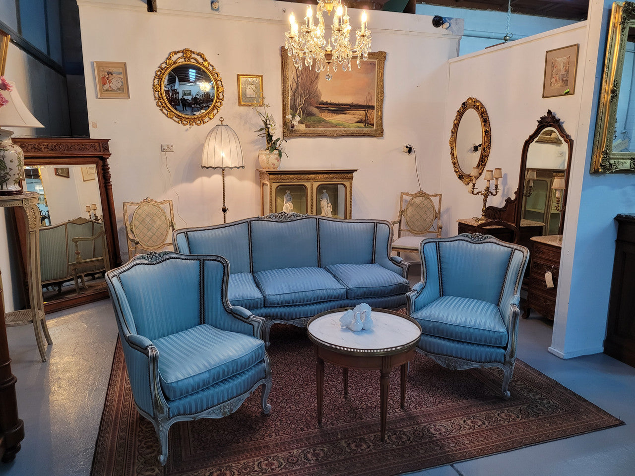 Well Proportioned Louis XV Salon Suite consisting of well proportioned 3 seater down cushioned, winged settee with 2 matching bergere chairs. All upholstered in stunning blue self stripe fabric. In excellent condition. Circa: 1930's.