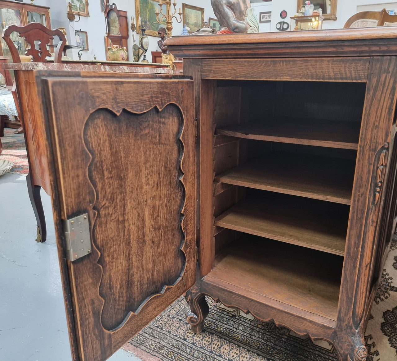 Fabulous Louis XV style French Oak beautifully carved full partners desk. Both sides have a functioning drawer in the middle and two cupboards either side. On both sides one cupboard door opens up to four smaller internal drawers. Plenty of storage space and a large top surface to work on. It is in good original detailed condition.