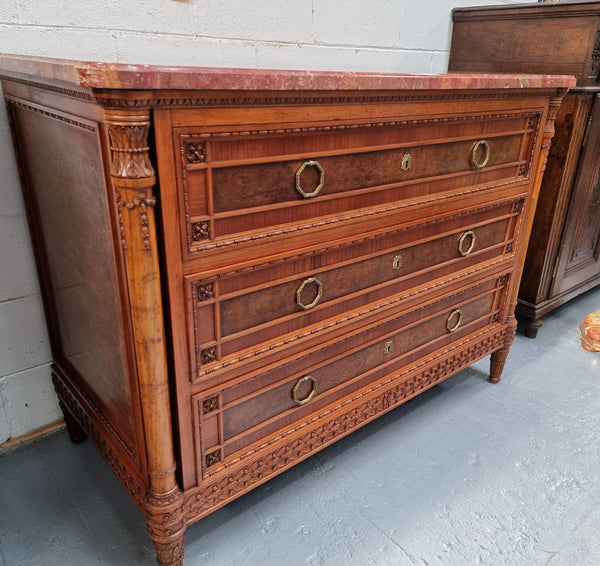 Lovely decorative French walnut and burr Walnut 3 drawer commode with a stunning coloured marble top and lovely carved details. In very good detailed condition.