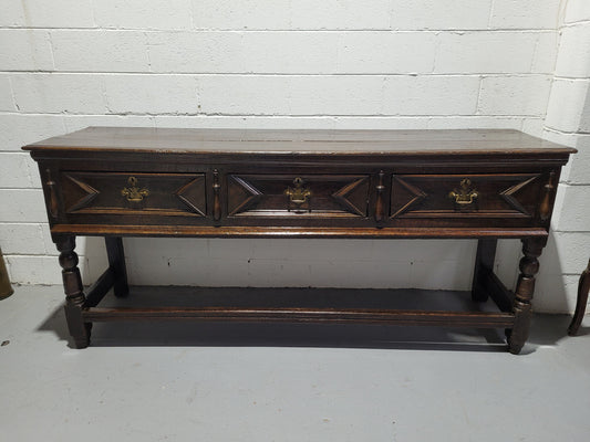 Early 19th Century Oak three drawer dresser Base in good original detailed condition commensurate with age.