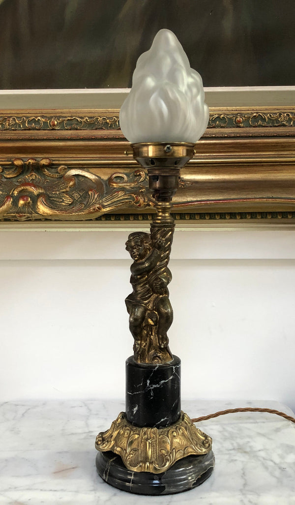 Vintage Brass cherub lamp with a marble and brass base and lovely frosted flame glass shade in good condition.
