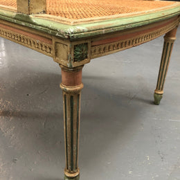 Painted French Louis XVI style cane panel arm chair. Paint is original and it is in very good original condition.