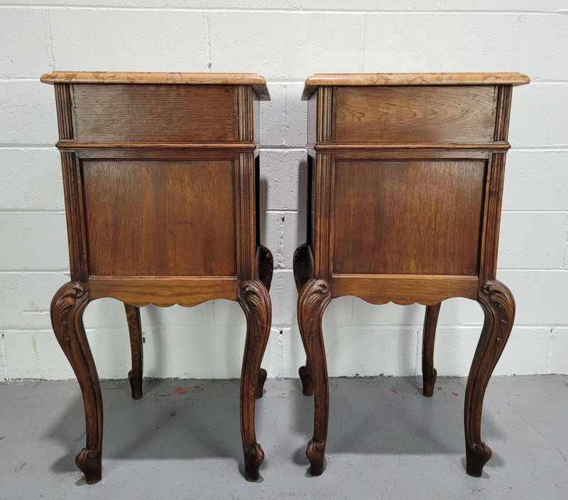 Stunning French walnut Henry II style marble top side cabinet with two drawers and two shelves inside. In good original detailed condition.