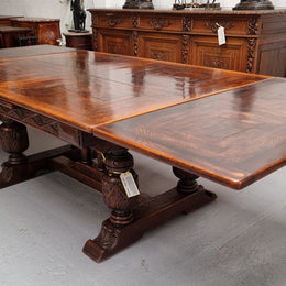 Renaissance style Oak extension table with parquetry top and twin pedestal base. The table extends by pulling out an extension leaf either side making it 287 cm long. Sourced from France and in good original detailed condition.