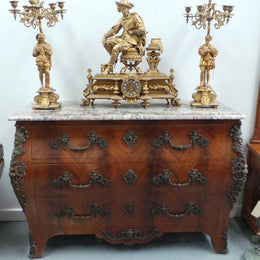 A Grand French Louis XV Style Flame Mahogany Commode