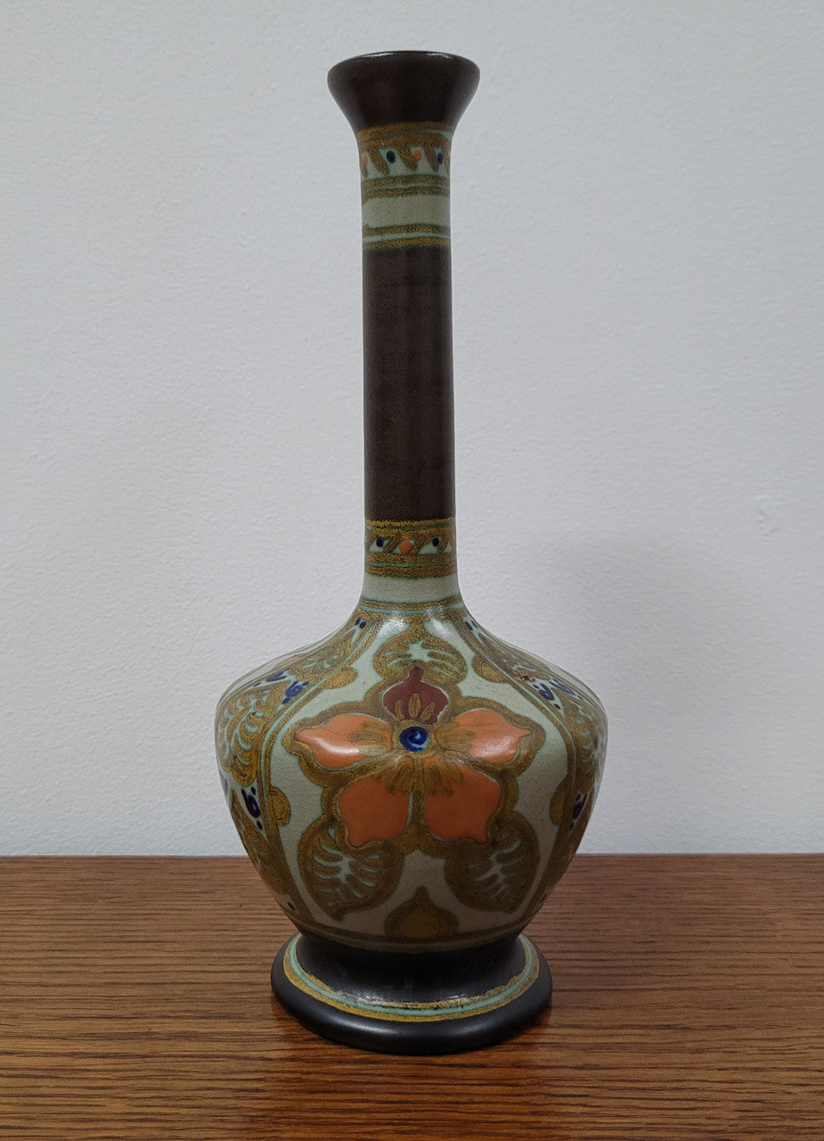 Elegant shaped Vintage Gouda vase hand decorated in the “Hilaire” pattern. Well marked on the Base. Light crazing on rim. Please see photos as they help form part of the description.