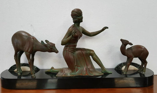 Absolutely gorgeous French cold painted metal Art Deco Statue of a lady and two deers on a marble base. Signed piece and in good original condition.