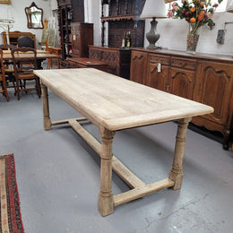 Beautilful raw solid oak French pedestal extension table. It has been sourced from France and is in good original detailed condition. When the table is fully extended it is 339 cm long and can comfortable seat 10-12 people. Features raw wood that could be used as is for a distressed look, or finished and waxed for a more refined look.