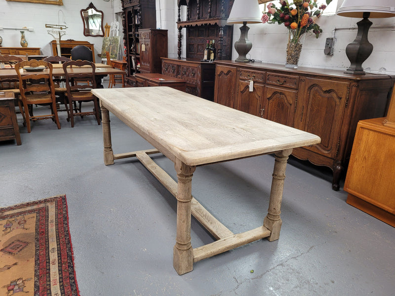 Beautilful raw solid oak French pedestal extension table. It has been sourced from France and is in good original detailed condition. When the table is fully extended it is 339 cm long and can comfortable seat 10-12 people. Features raw wood that could be used as is for a distressed look, or finished and waxed for a more refined look.