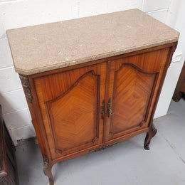 Stunning compact Louis 15th style two door walnut cabinet with ormolu trim and marble top. It is in good original condition.