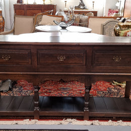 A very hard to find Vintage English kitchen dresser base of narrow proportions, sourced from France. In good original detailed condition.