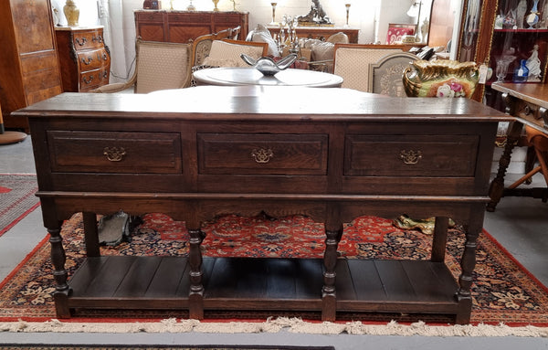 A very hard to find Vintage English kitchen dresser base of narrow proportions, sourced from France. In good original detailed condition.