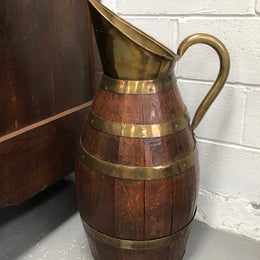 French Oak with Copper large wine jug. In good original detailed condition.