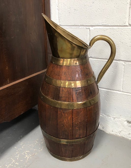 French Oak with Copper large wine jug. In good original detailed condition.