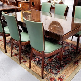 French Art Deco Figured Walnut dining table and six chairs. This stylish table also comes with a glass top and can be used with or without it. The chairs are very comfortable and the table can also fit another two chairs at either end making it a 6-8 seater. The table is in good original detailed condition with character marks to the top of table as shown in the pictures. This table and six chairs have been sourced locally.