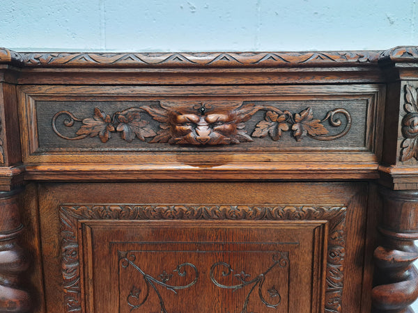 French Henry 2nd Oak Side Cabinet of pleasing narrow proportions.  Carving on the cup board and drawer fronts with barley twist columns.