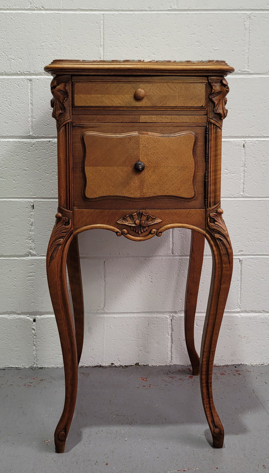 Single French Louis XV style Walnut inset marble top bedside. It has one drawer and one cupboard. It is in good original detailed condition.