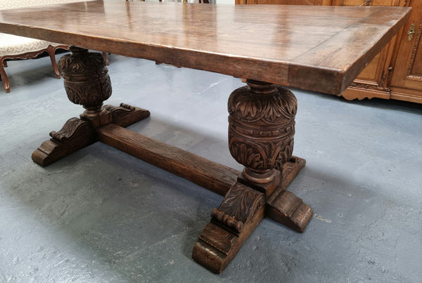 A beautifully carved 19th Century French Oak farmhouse table with a "bulbous base". It is in very good original detailed condition.