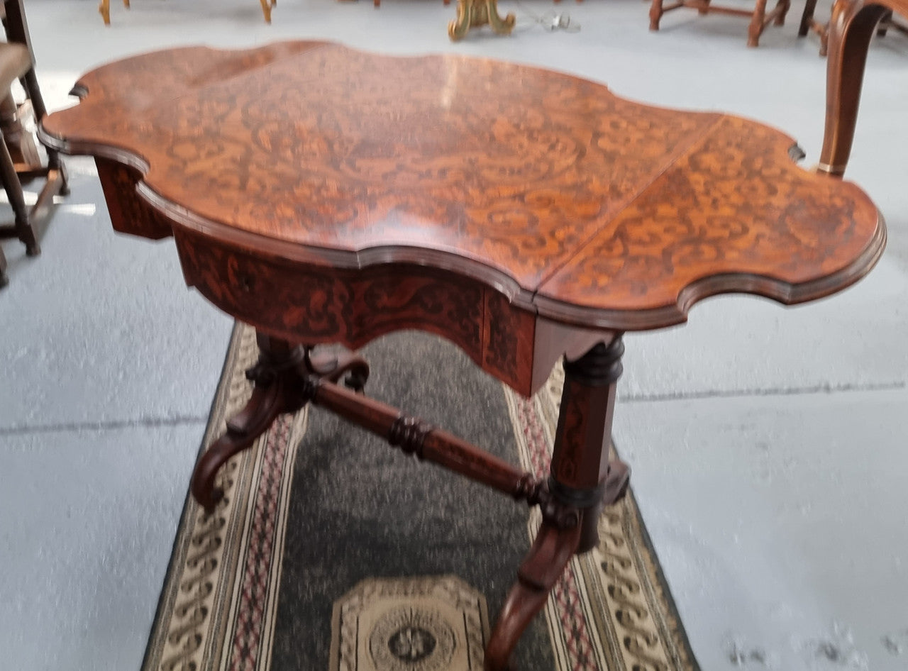 Fabulous marquetry inlaid side table with marquetry extensions and one drawer. Stunning side table or small ladies desk.