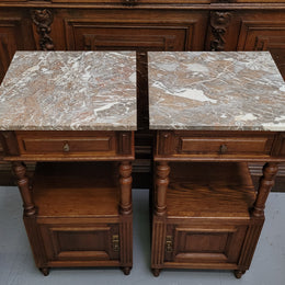 Pair of French Antique Oak marble top bedsides Henry II style. They have a drawer, cupboard and an open shelf for all your storage needs. They have been sourced from France and are in good original detailed condition.