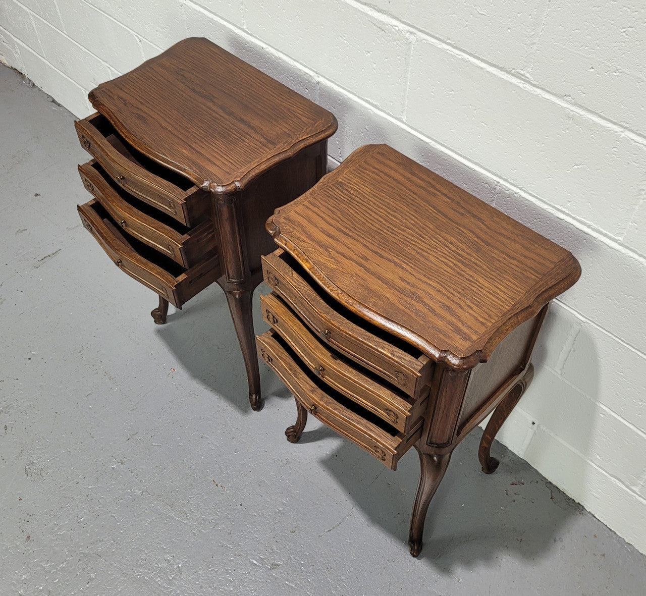 Lovely Louis XV style oak bedside cabinets with three drawers. In great original detailed condition.