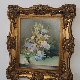 Stunning gilt frame with signed oil on canvas depicting floral arrangement in vase. In good original detailed condition.