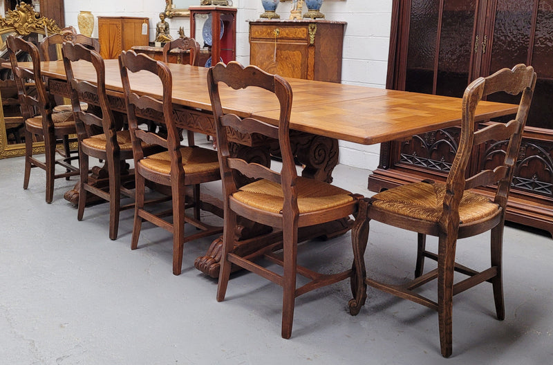 Amazing French Oak Renaissance style parquetry top extension table. Beautiful parquetry top and amazing detailed carvings on the legs. It extends to 306 cm long when fully extended. Sourced from France and in good original detailed condition.