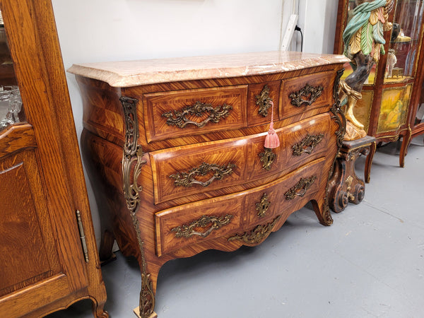 Beautiful French Louis XV style Kingwood inlaid marble top four drawer commode. It has decorative mounts and has been sourced from France. It is in good original detailed condition.