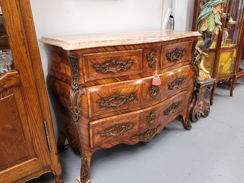 Beautiful French Louis XV style Kingwood inlaid marble top four drawer commode. It has decorative mounts and has been sourced from France. It is in good original detailed condition.