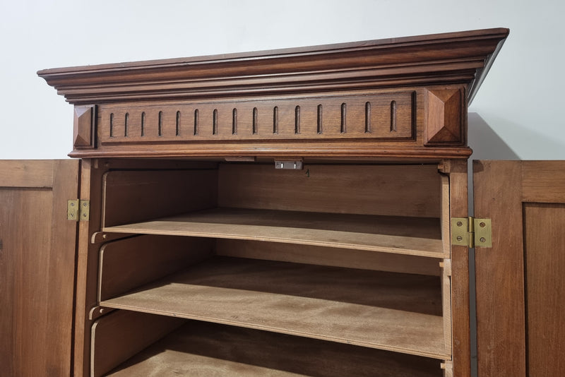 French Henry II style Walnut linen storage cupboard with nine pull out shelves. This piece could be very functional for a range of different purposes including shoe storage. It is in good original detailed condition, please note the door lock no longer functions and opens by pulling the door.