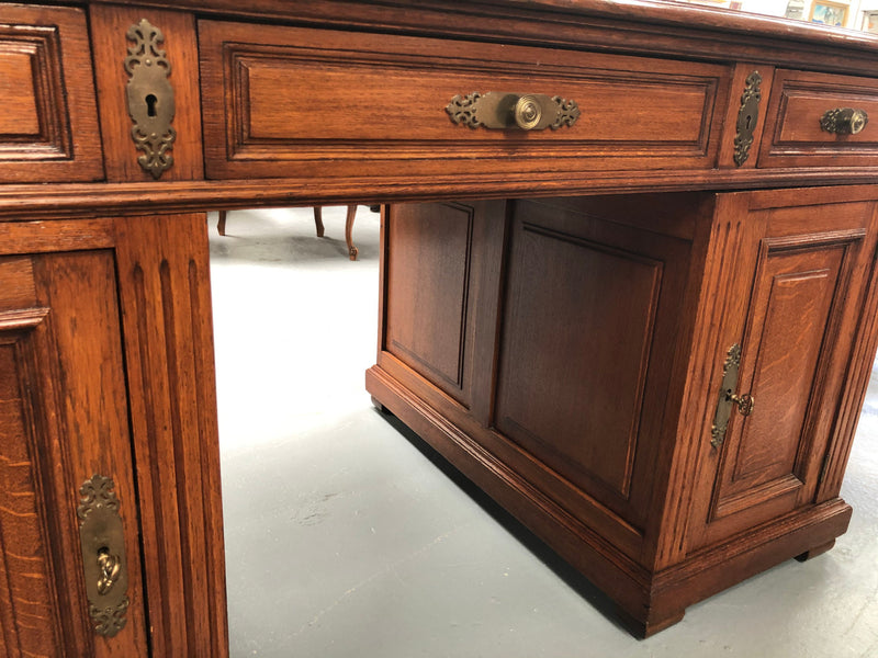 Antique French oak partners desk with plenty of drawers and cupboards and has an inbuilt Chubb Safe with keys. In very good condition.