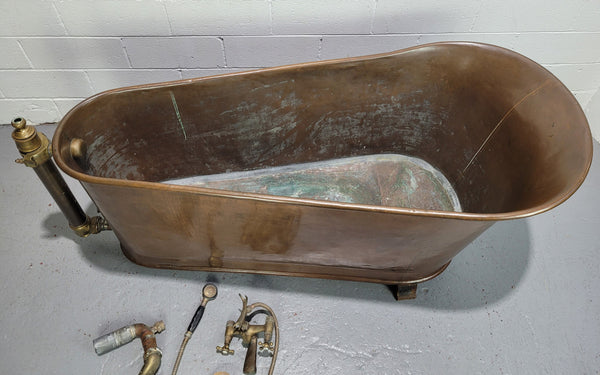Sourced from France a rare full copper Antique bath tub on feet and includes an overflow, fittings, taps ect. In good original condition.